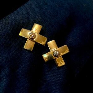 St. John vintage Signed gold toned clip on earrings.